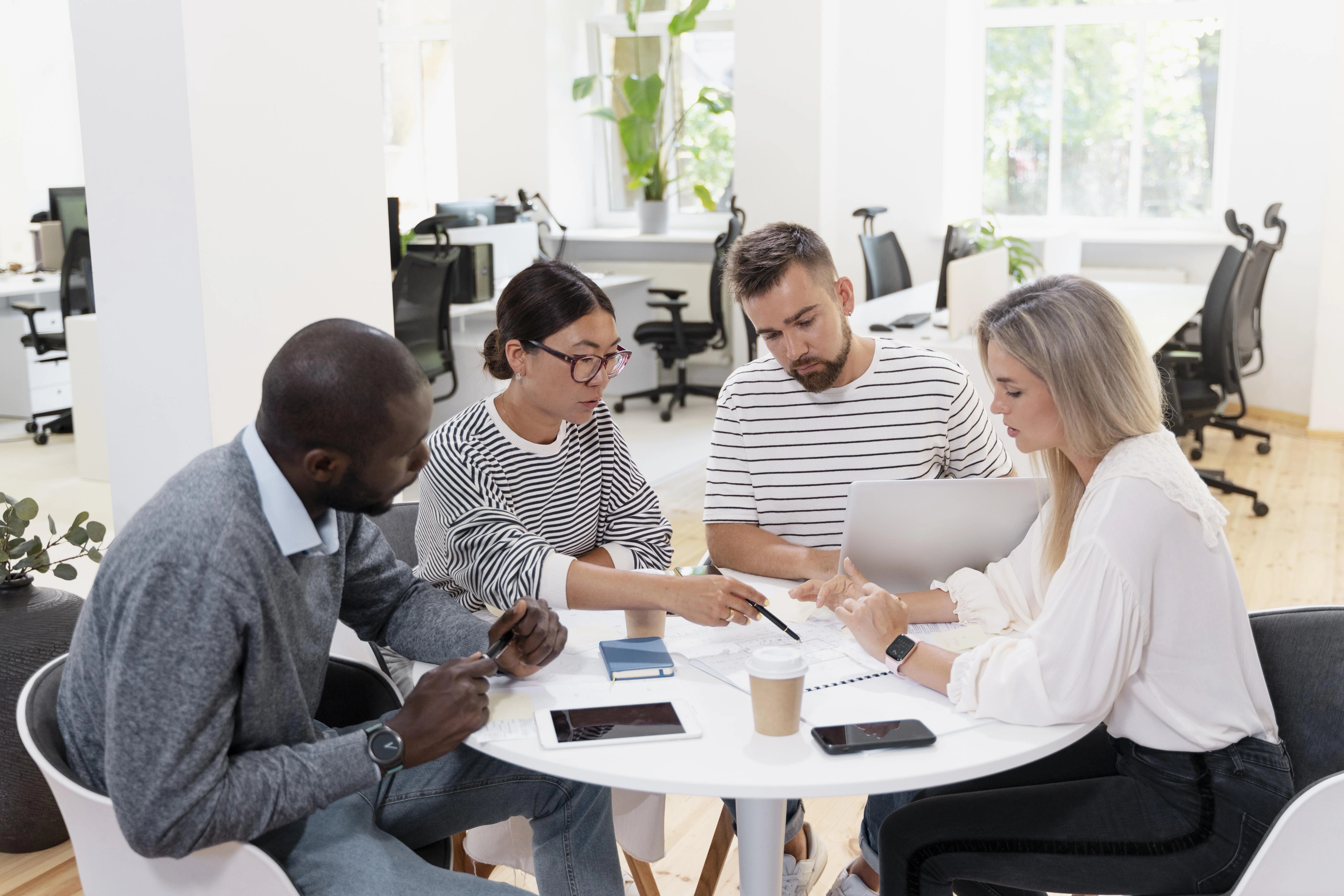 Team members collaborating with client